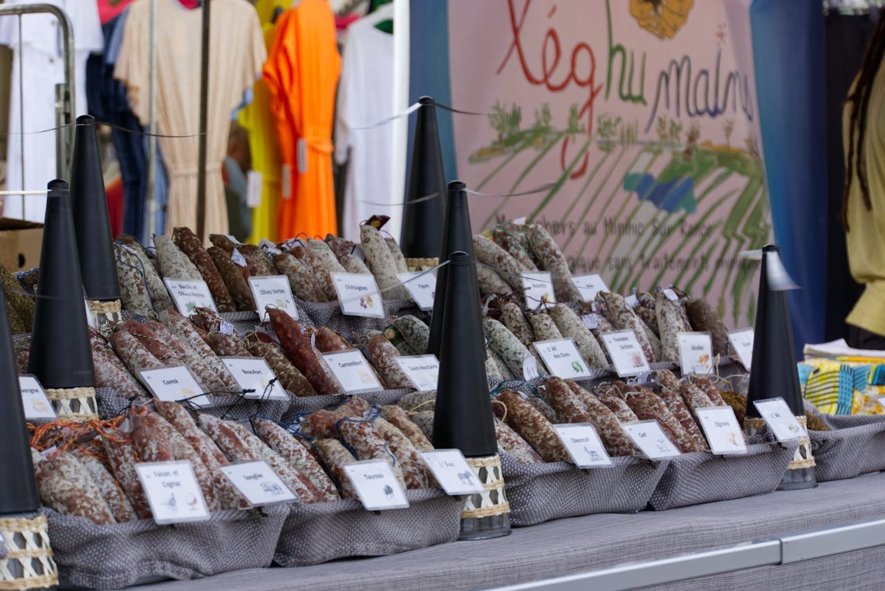 Embutidos Huétor Tájar Granada. Colorful market stall in Dinard, France showcasing a variety of artisan sausages.