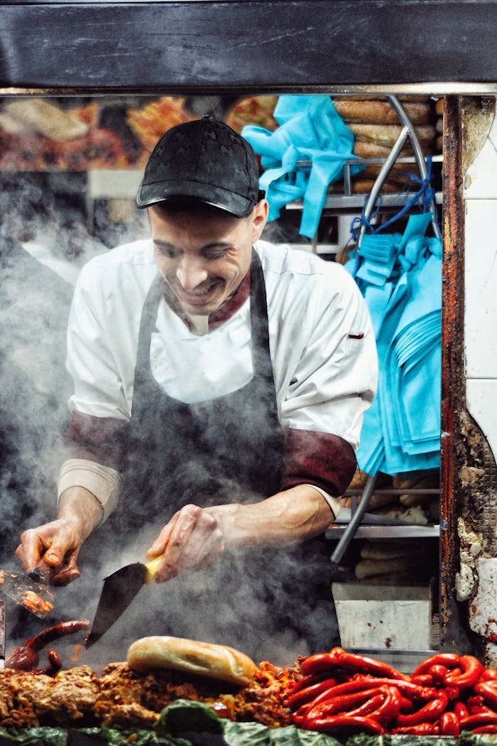 Venta Embutidos en Granada . Street food vendor cooking spicy sausages in Rabat market.